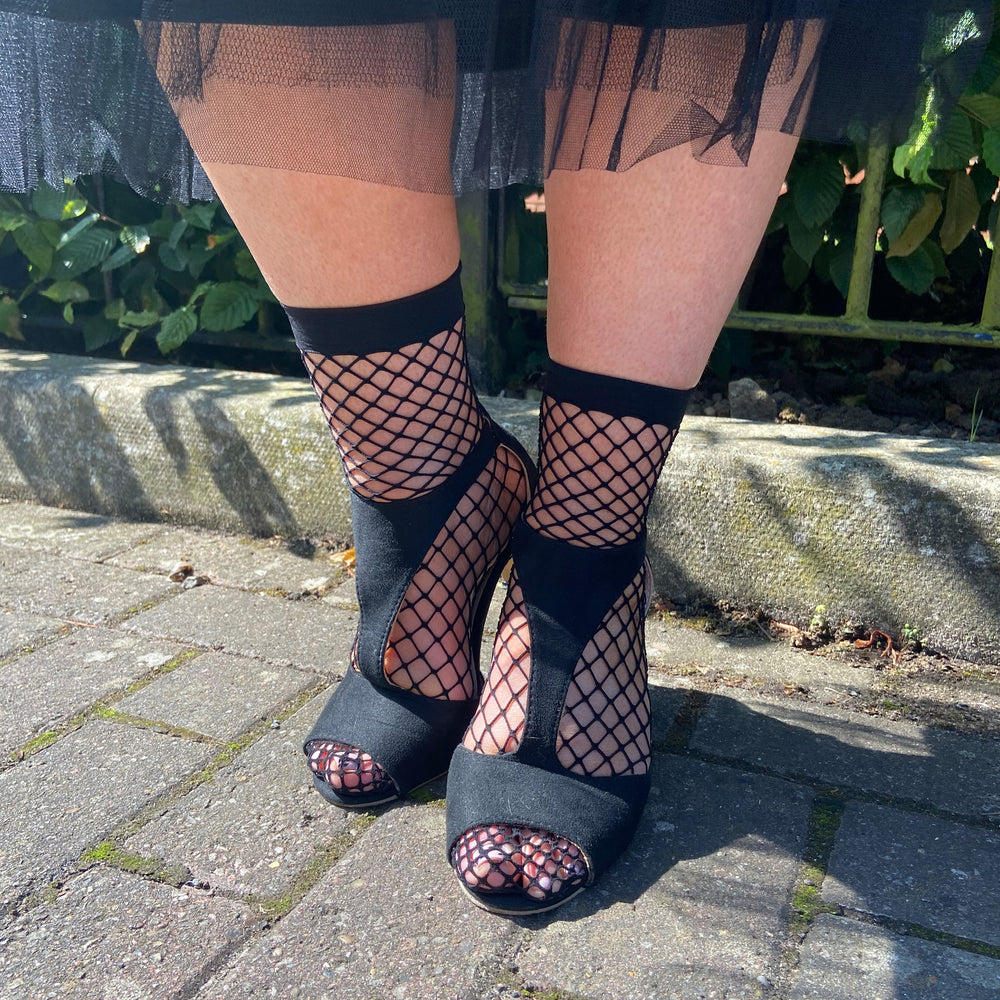 
                  
                    large fishnet socks black 
                  
                