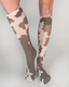 Brown and cream cow camo knee high socks featuring a soft knit fabric perfect for casual wear