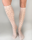 Beige soft dot knee high socks featuring black polka dots for comfortable stylish wear