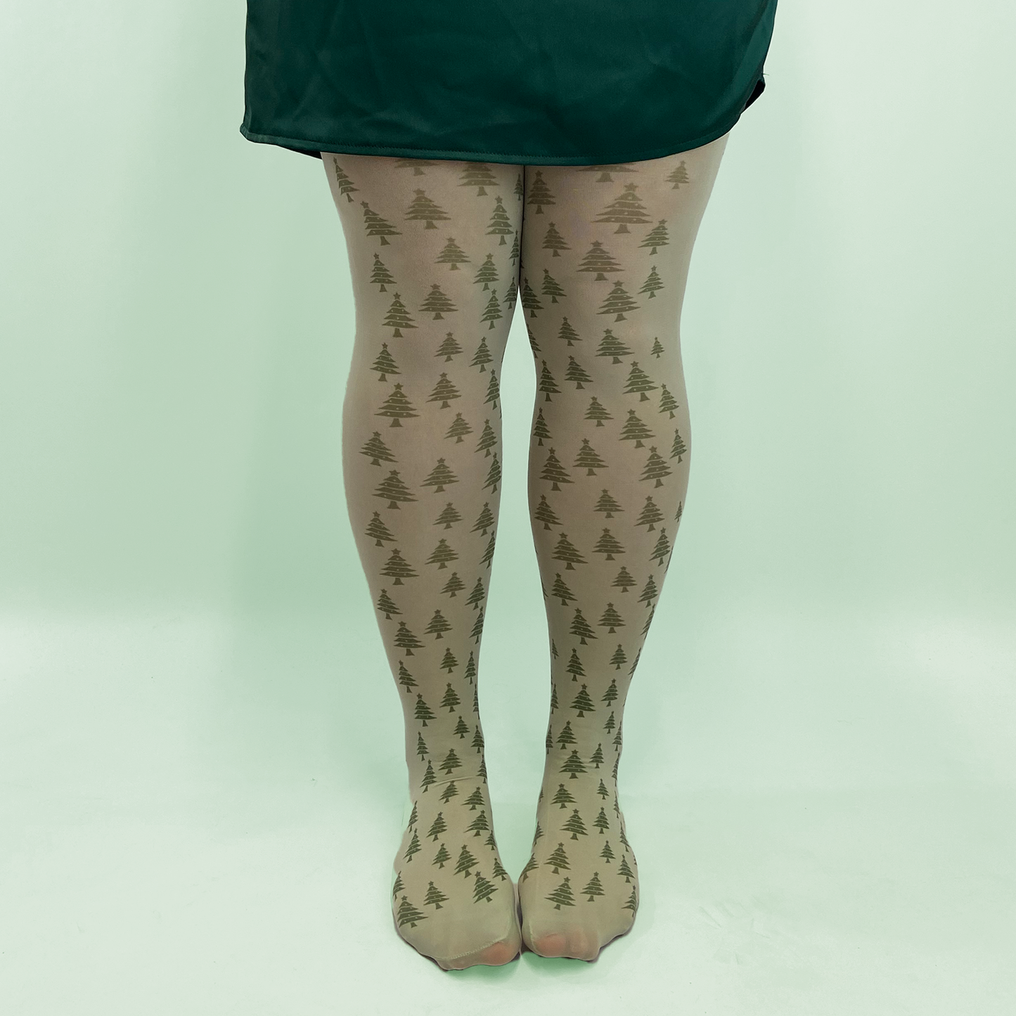 
                  
                    Green Christmas tree printed tights 
                  
                