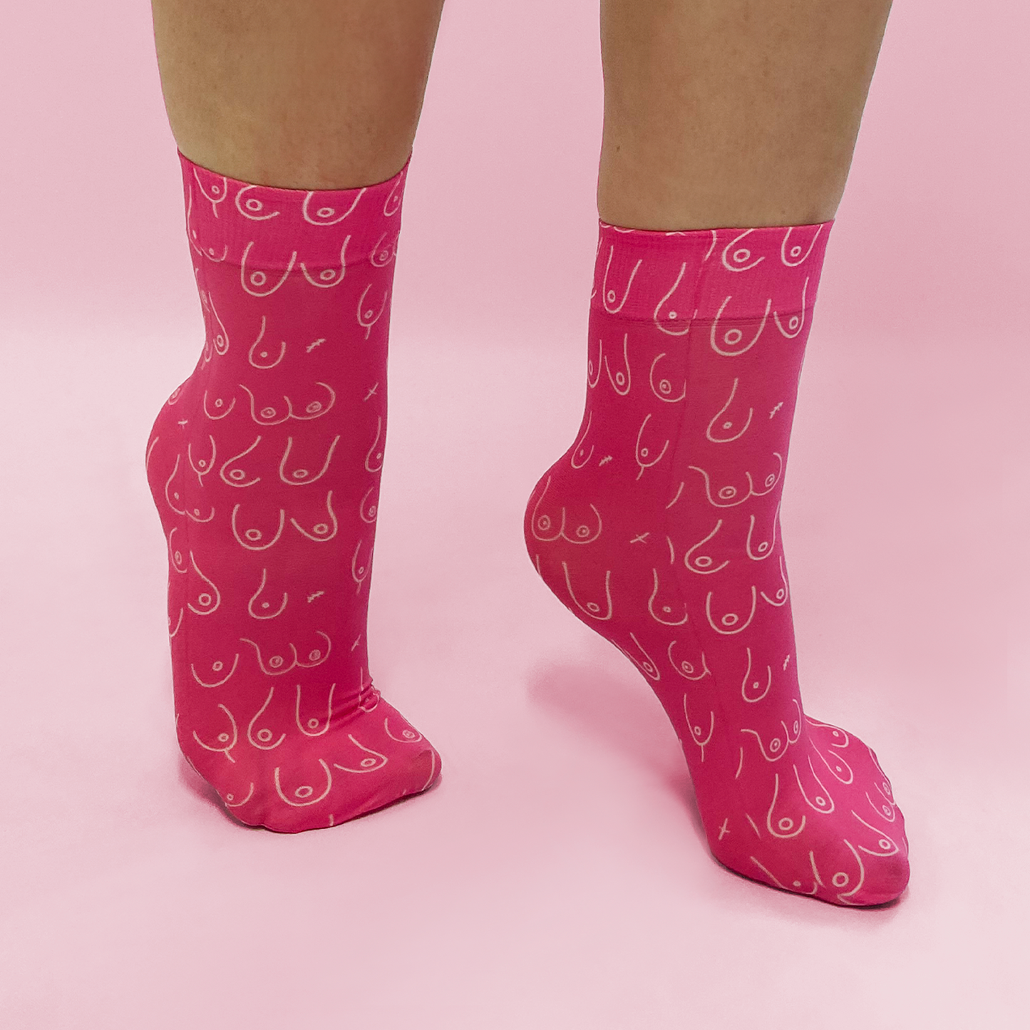 
                  
                    all over boob printed pink socks 
                  
                