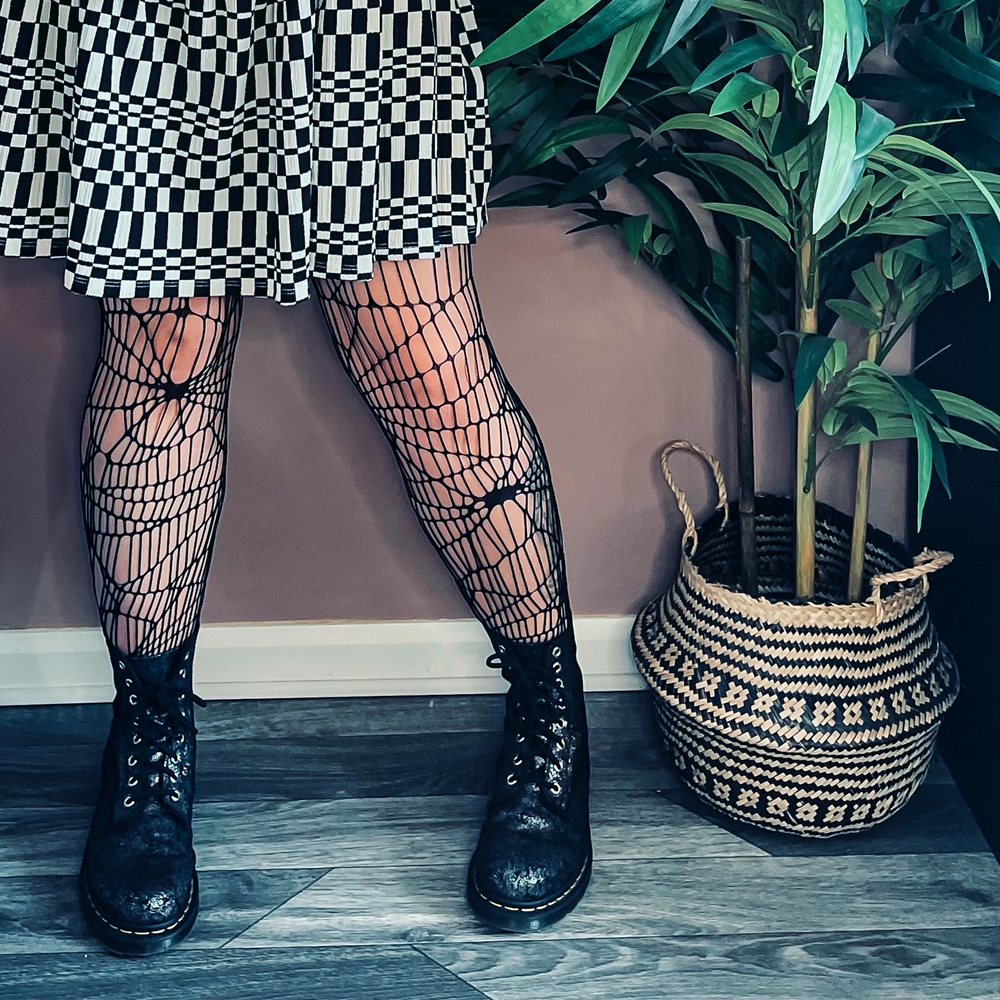 
                  
                    Black Cobweb Net Tights
                  
                