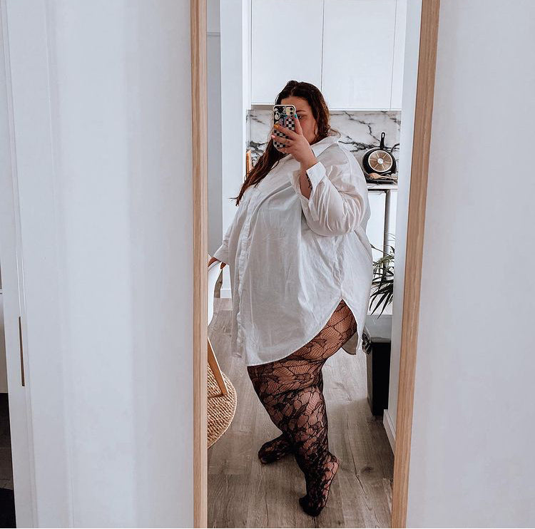 
                  
                    Black Netted Tights with Orchid Leaf Design 
                  
                