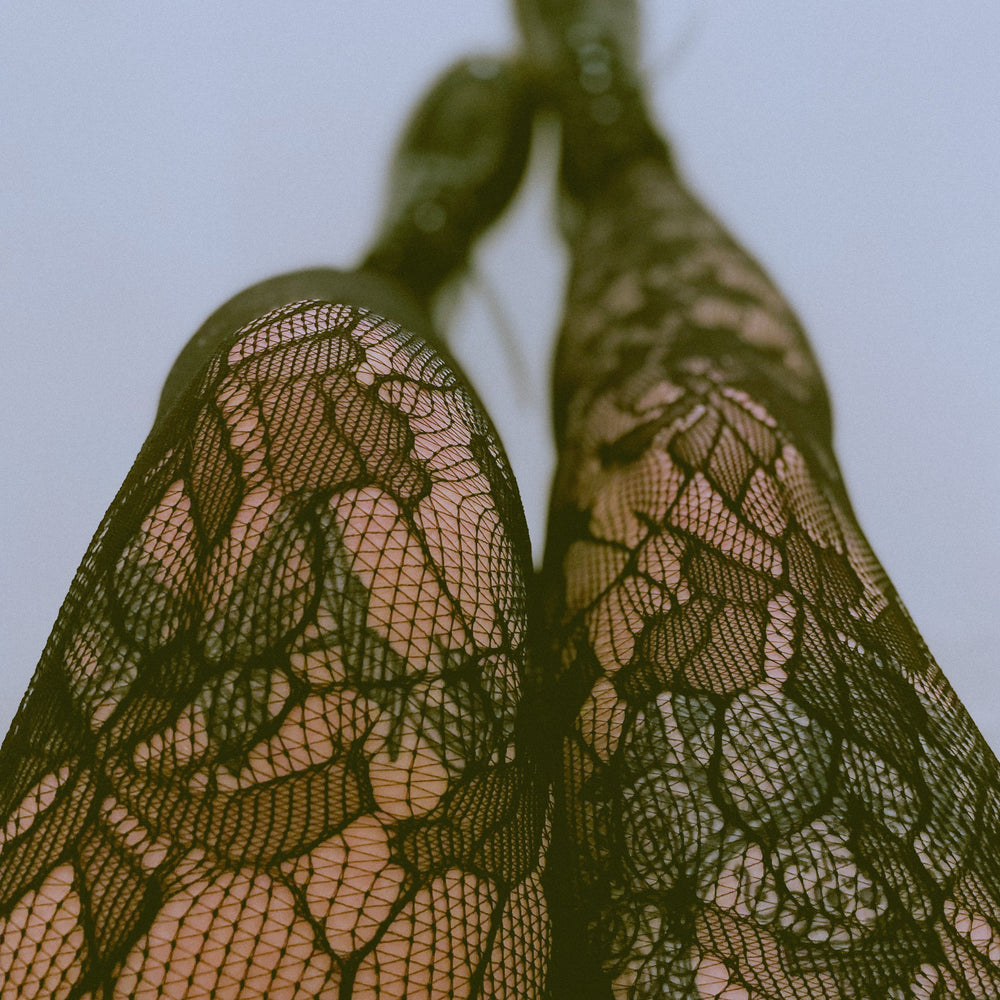 
                  
                    Green Netted Tights with Orchid Leaf Design 
                  
                